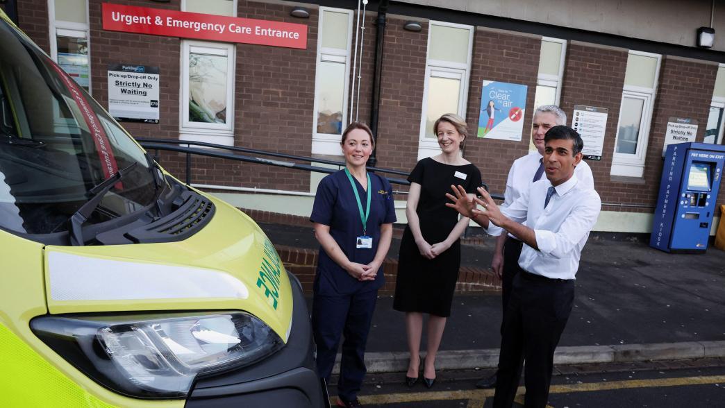 Rishi Sunak outside a hospital, with Steve Barclay, Amanda Pritchard and an NHS staff member
