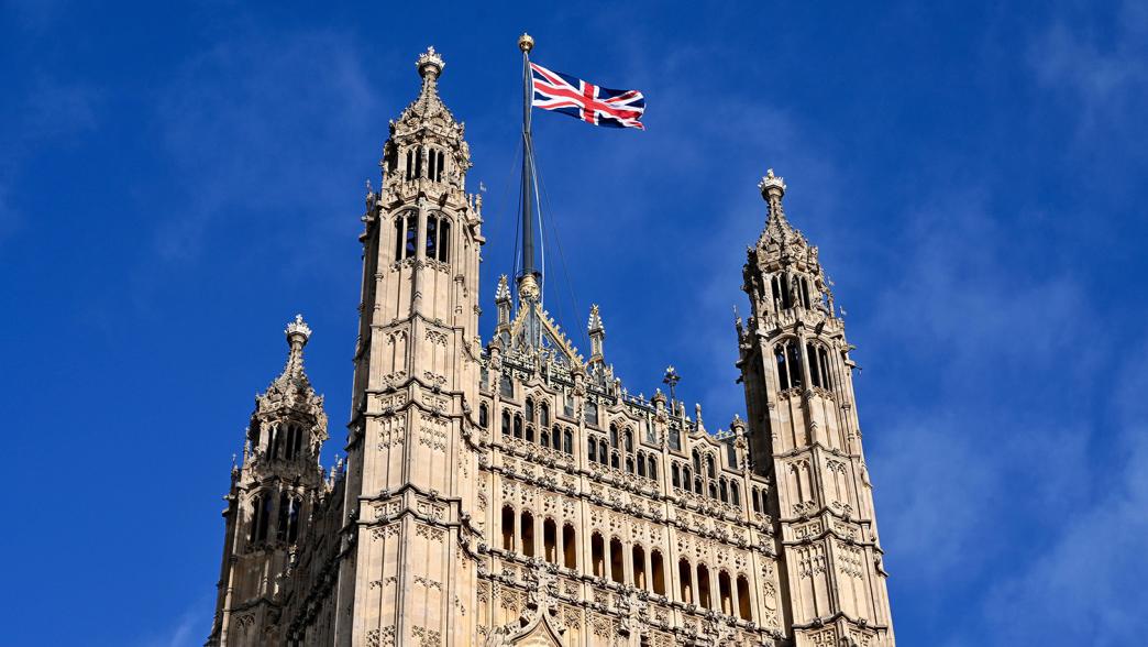 Houses of Parliament with a flying Union Jack flag