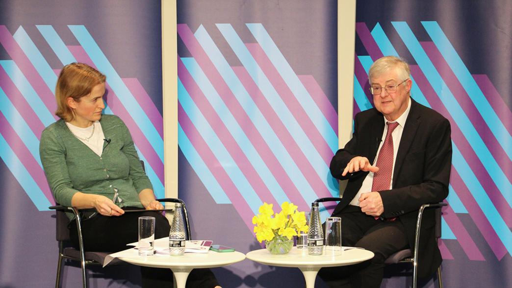 Dr Hannah White and Mark Drakeford on stage at the Institute for Government