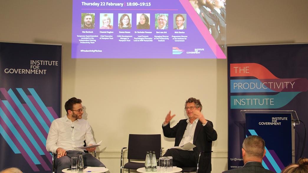 Nick Davies and Professor Bart van Ark on stage at an event at the Institute for Government