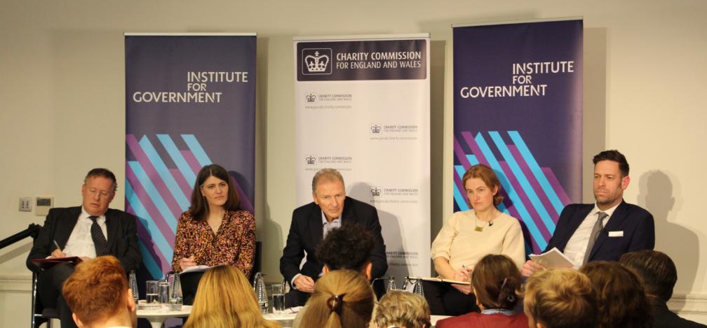 panel on stage at the Institute for Government
