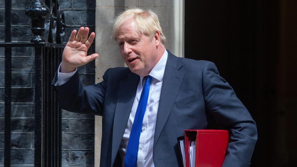 Boris Johnson waving as he leaves No.10