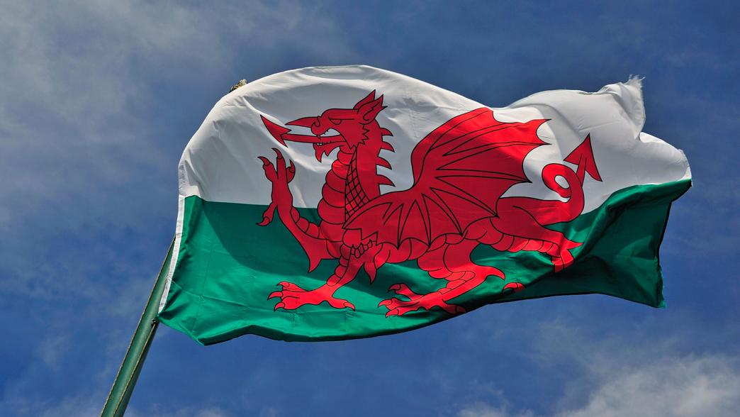 Welsh flag against a blue sky