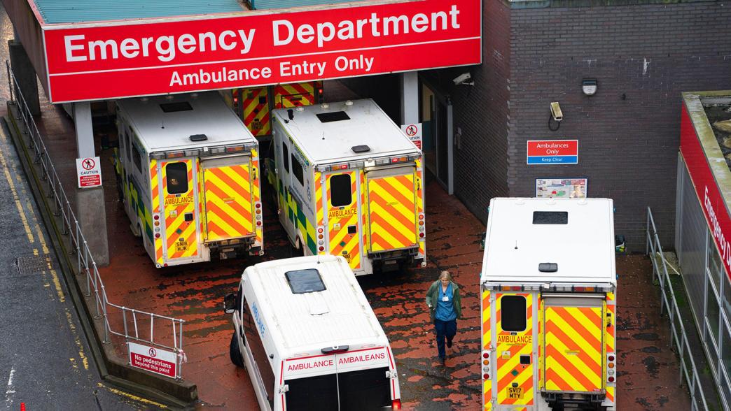 A backlog of ambulances outside an emergency department.