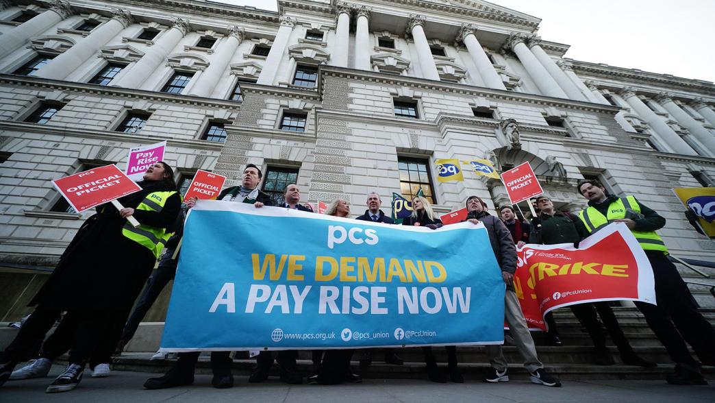 Union members on the picket line outside the Treasury in Whitehall.