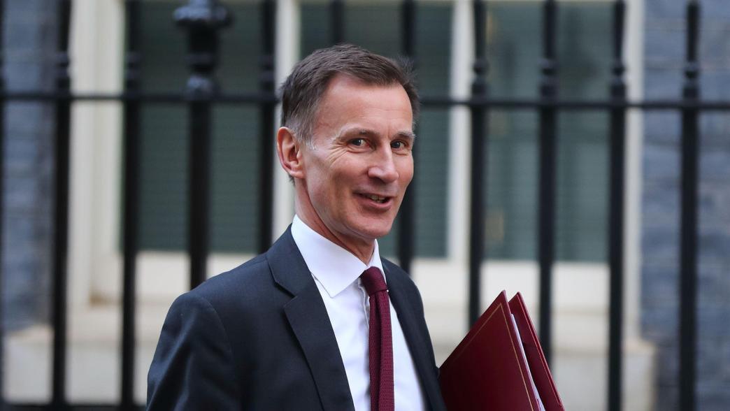 Chancellor Jeremy Hunt leaving Downing Street, February 2023. In his hand is a red minister's folder.