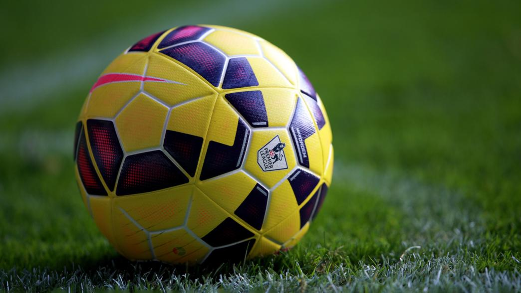 A Premier League winter match ball on the grass.