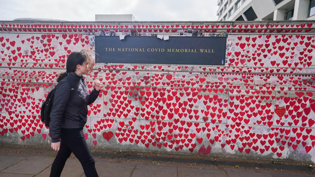The National Covid Memorial Wall. On the wall are red and pink hearts to commemorate the victims of the Covid-19 pandemic.
