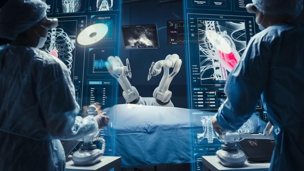 Surgeon wearing AR headsets and using high-precision remote controlled robot arms to operate.