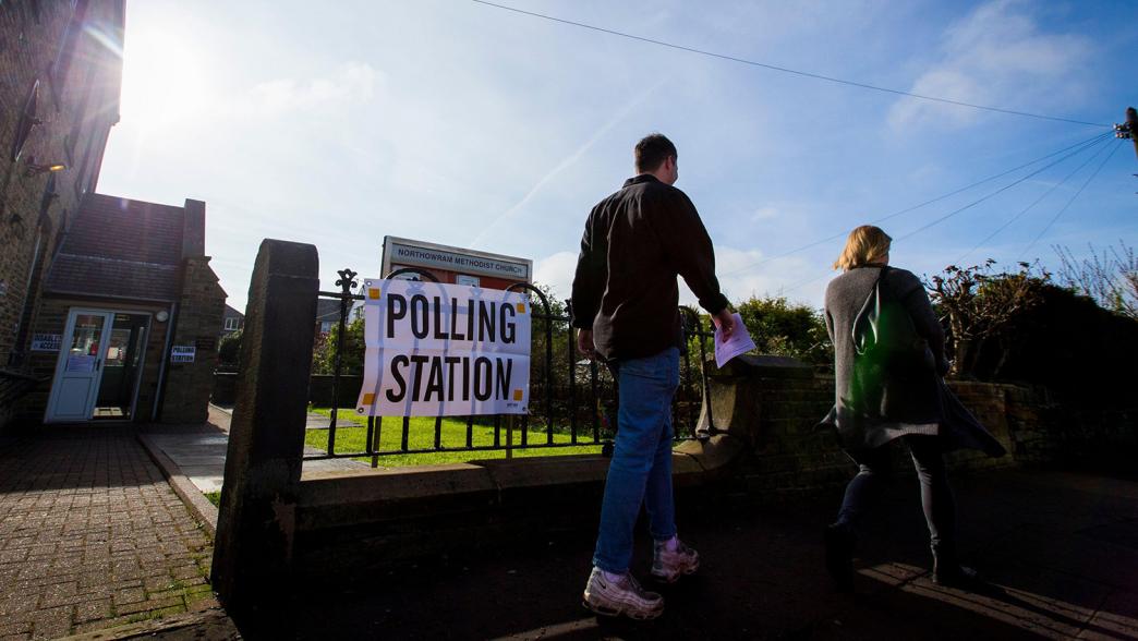 Voters leaving a polling station in Halifax, Yorkshire.