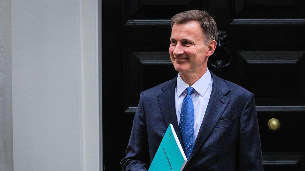 Chancellor of the exchequer Jeremy Hunt leaves Downing Street with his autumn statement 2023 in hand