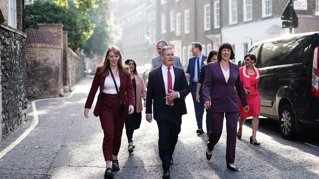 Labour frontbench ministers walking down a road.