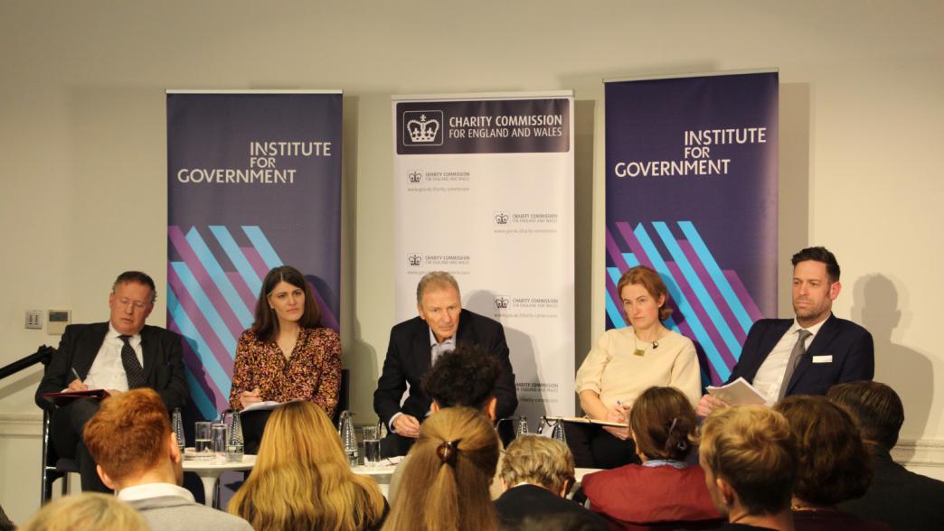 panel on stage at the Institute for Government