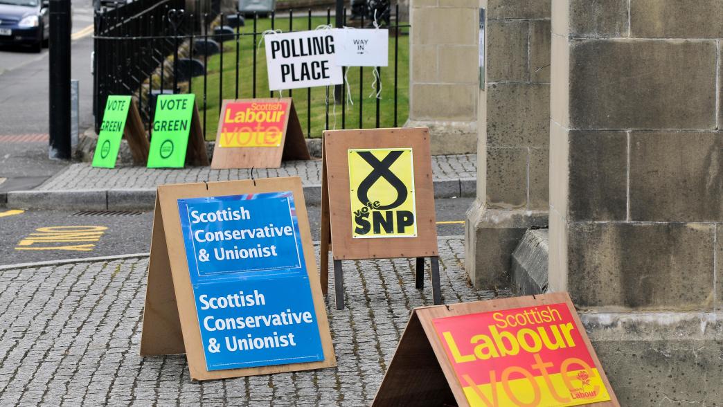 Party placards outside a polling station