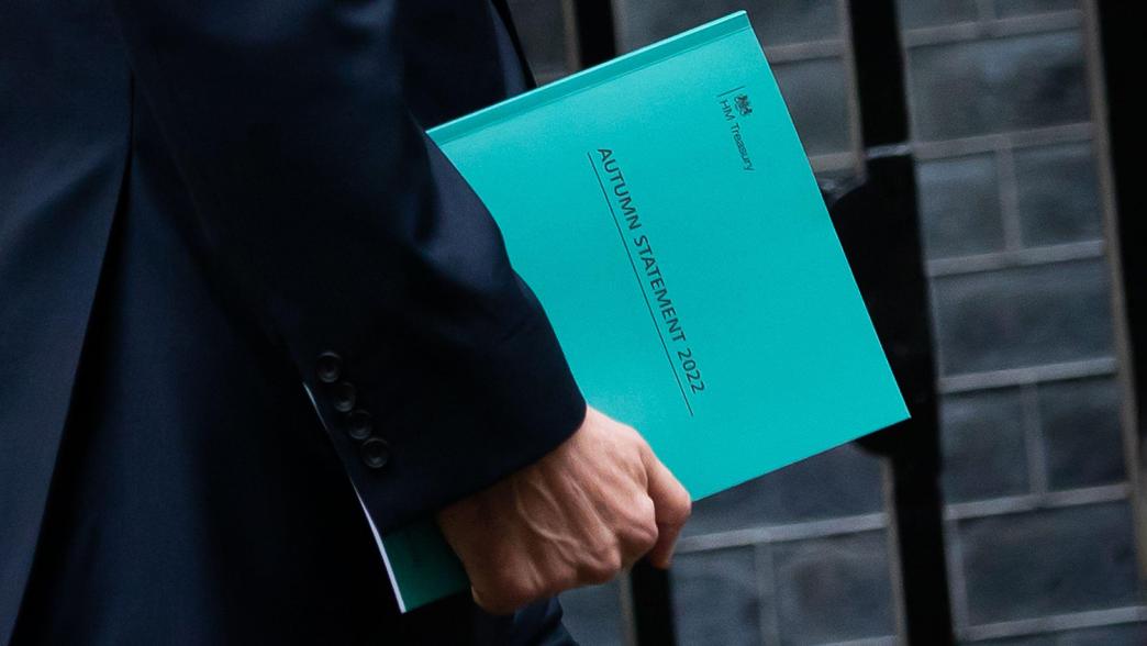 A close-up of chancellor Jeremy Hunt carrying the autumn statement 2022.