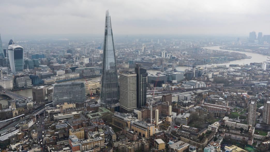 Aerial photograph showing the Shard with the City of London and Canary Wharf