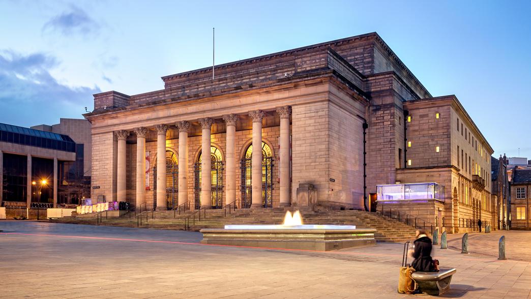 Sheffield City Hall illuminated in the evening.