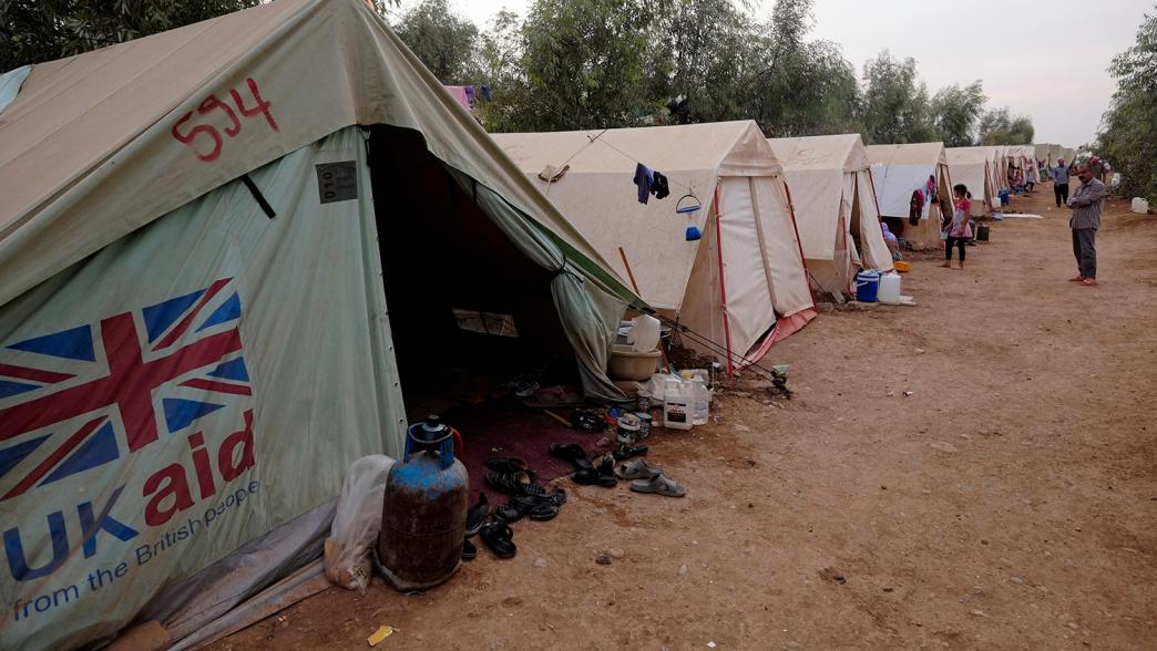 A temporary shelter tent donated by UK aid (The United Kingdom government department responsible for administering overseas aid) at a refugee camp for displaced people from the minority Yazidi sect which were driven from their homes in Sinjar by Islamic State militants in the city of Zakho Northern Iraq