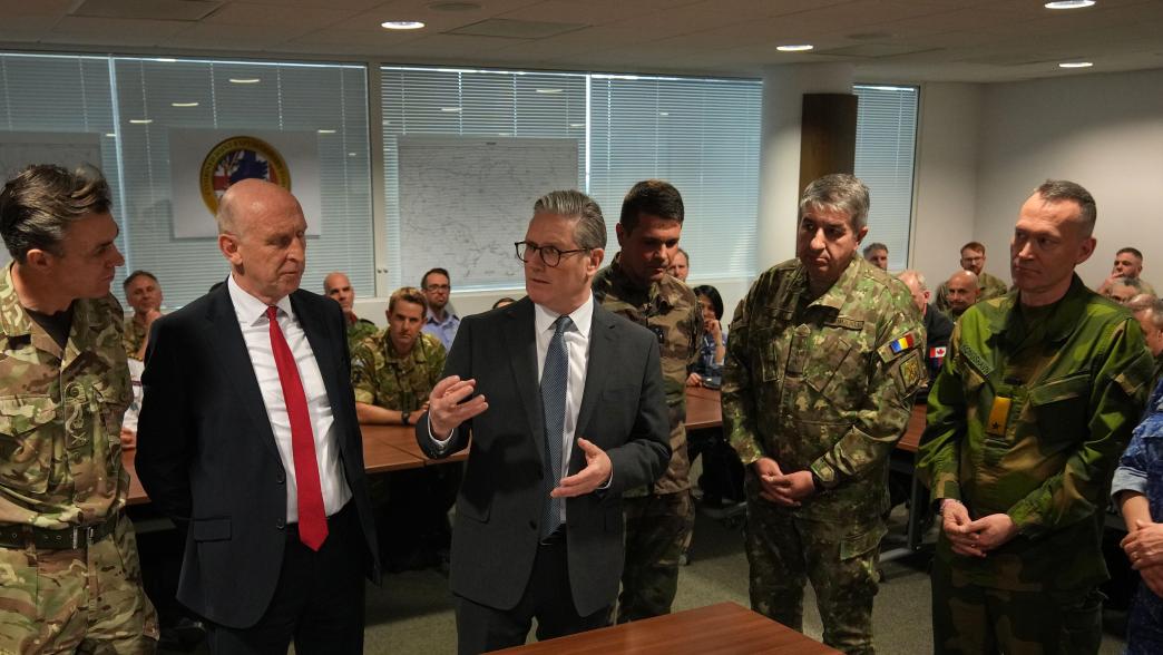 Prime Minister Sir Keir Starmer (center right) and Defence Secretary John Healey (centre left) speak to General Nick Perry Chief of Joint Operations (left) in front of a Ukraine map during a visit to a military base in south east England to meet with military planners mapping out next steps in the Coalition of the Willing.