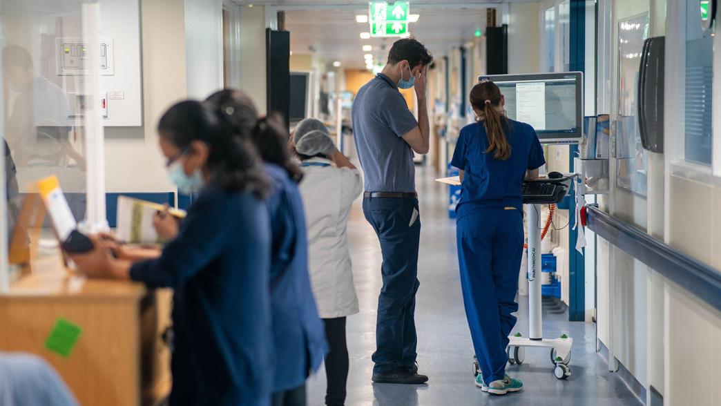 General view of staff on a NHS hospital ward at Ealing Hospital in London