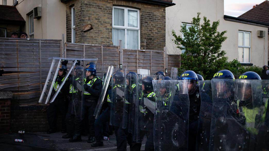 Riot police in a row with protective gear