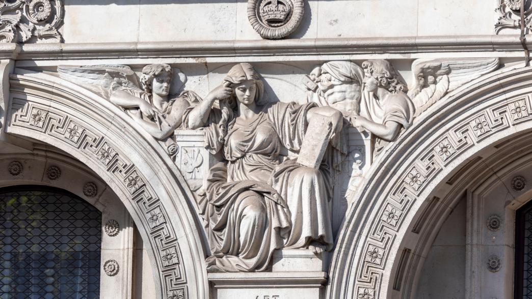 Stonework detail on Foreign, Commonwealth and Development Office building housing government departments, London, UK. Art sculpture