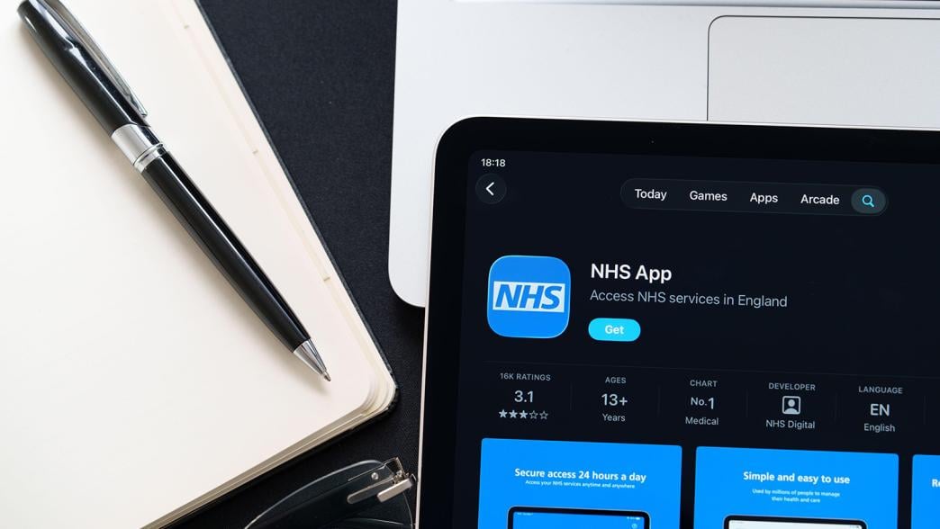 A close-up of the NHS Digital App on a tablet screen.