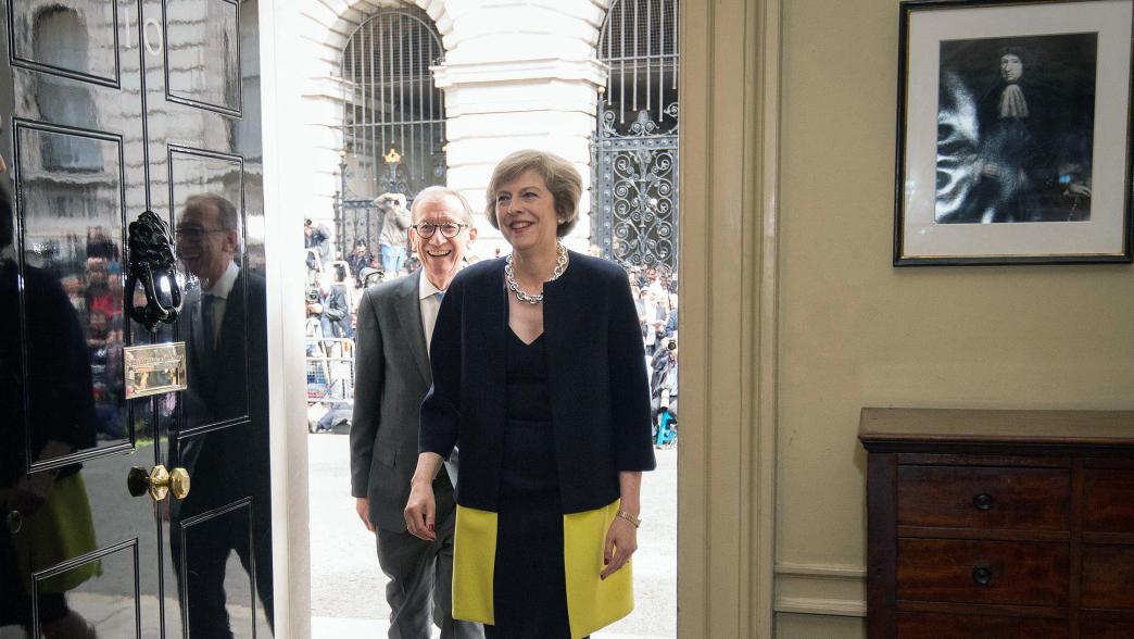 Theresa May, followed by her husband Philip May, walk into 10 Downing Street, London, Wednesday July 13, 2016. 