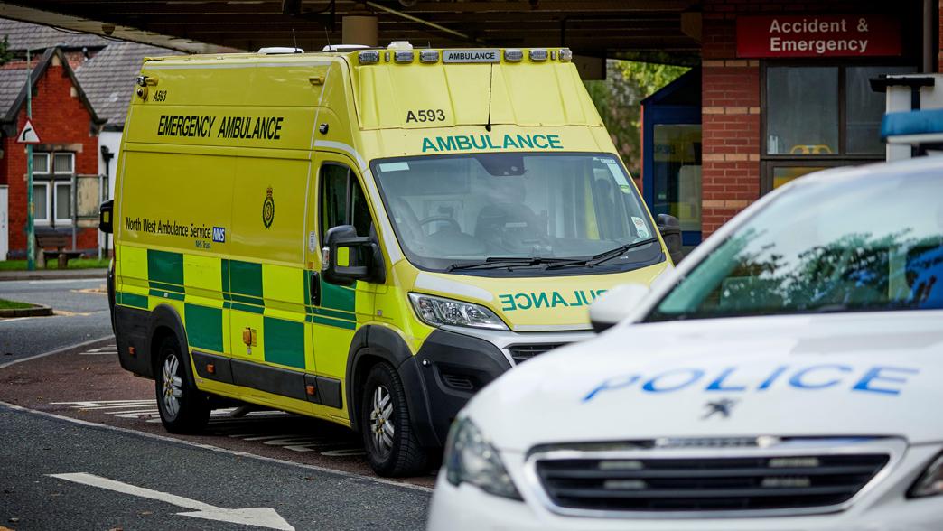 Ambulance and police car at A&E North Manchester General Hospital