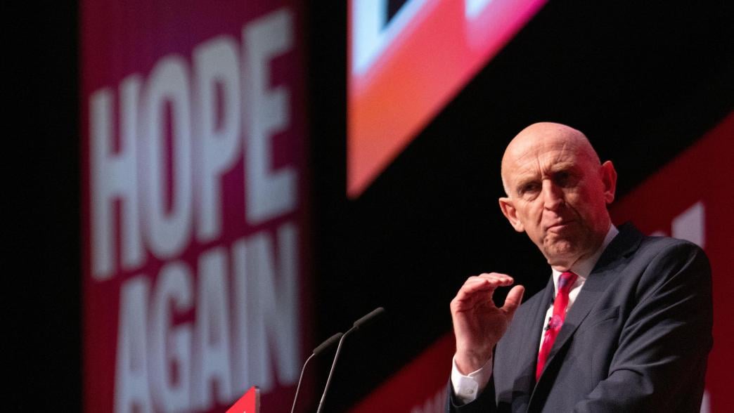 John Healey on stage at the Labour Party Conference.