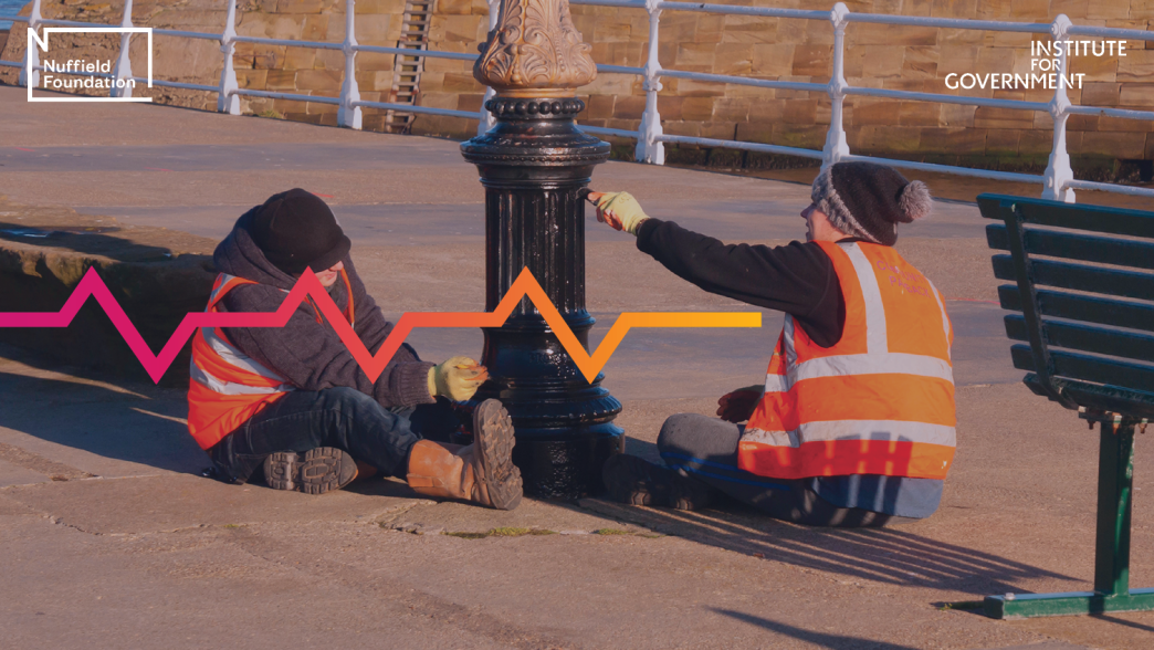Two offenders on the Community Payback scheme, administered by the Probation Service, painting a lamppost on Whitby Pier
