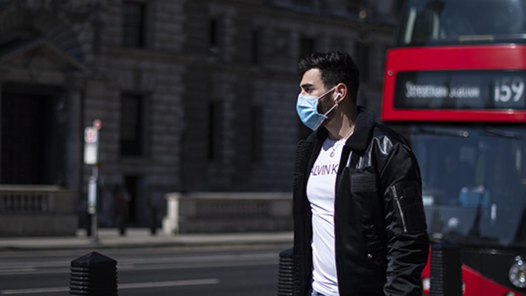 Guy in London wearing a face mask