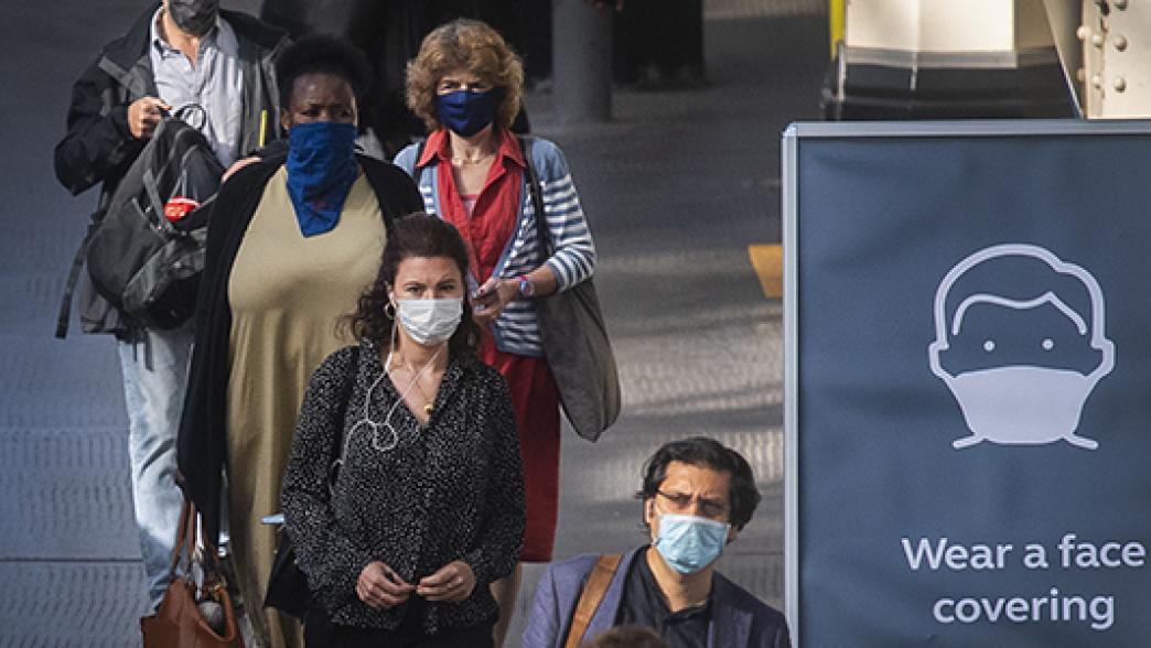 Commuters wearing face masks