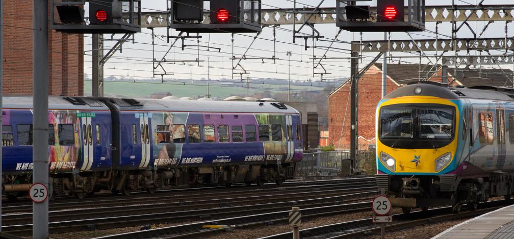 Trans Pennine Express and Northern Arriva Rail North Services pass at Leeds Railway Station