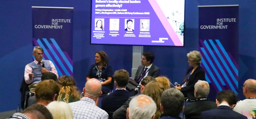 A panel of speakers on stage at the Reform UK party conference.