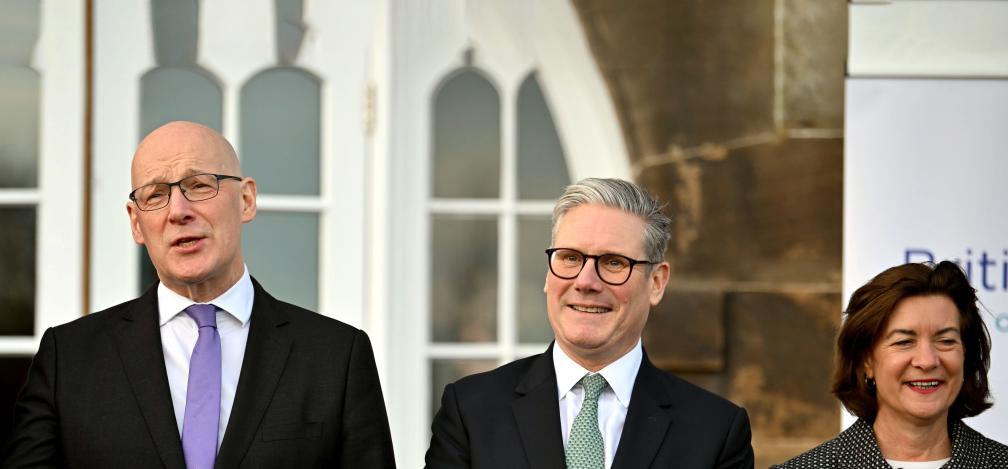 (left to right) Scotland's First Minister John Swinney, Prime Minister Sir Keir Starmer and Wales' First Minister Eluned Morgan talk as they come out to pose for a family photograph during the British-Irish Council (BIC) summit in Edinburgh. 
