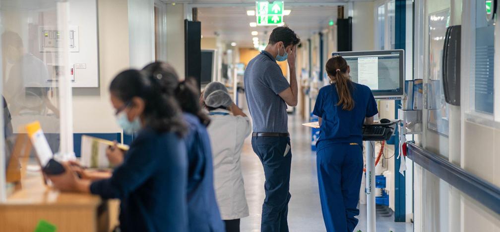 General view of staff on a NHS hospital ward at Ealing Hospital in London