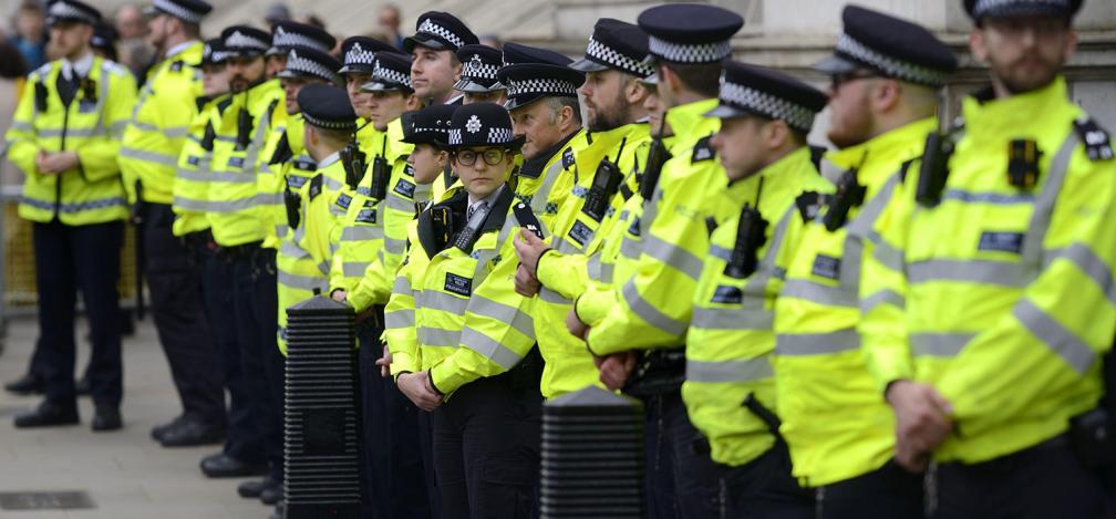 Line of police officers guarding Downing Street during a protest march