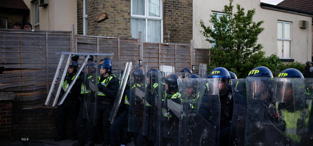 Riot police in a row with protective gear