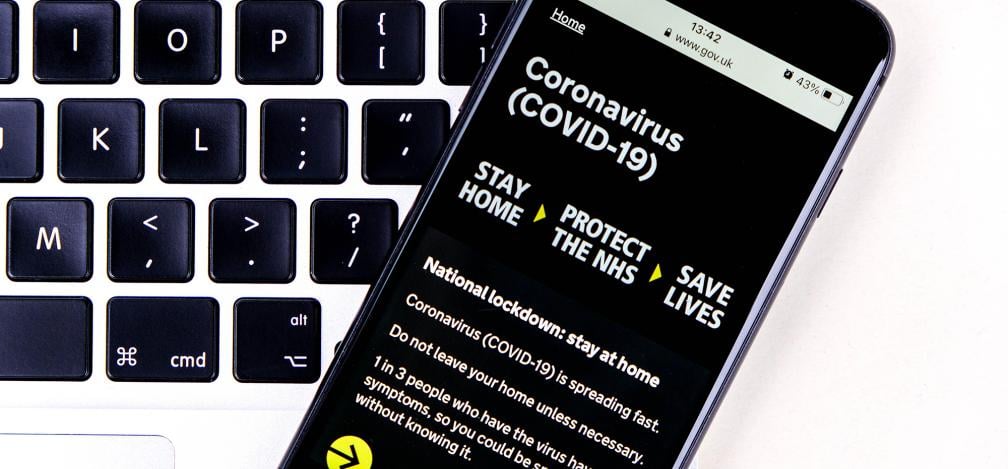 An image of the GOV.UK website on a mobile device, showing the Coronavirus guidance.