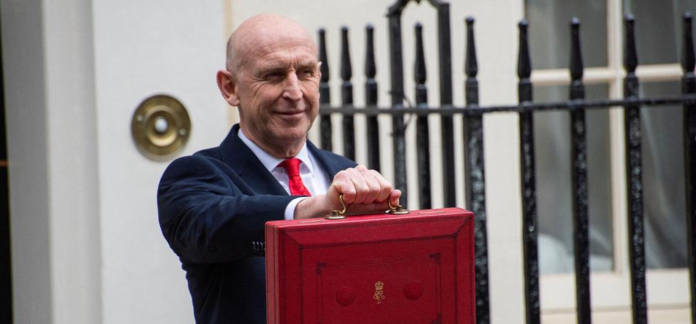 John Healey with the budget case outside No.11 Downing Street.