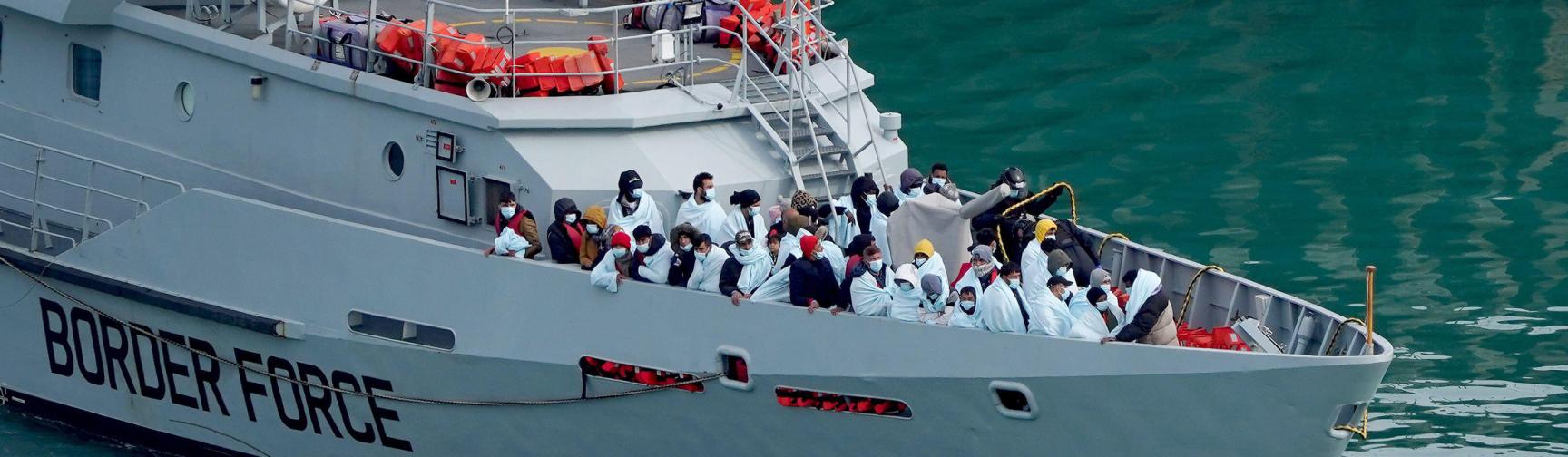 A group of people thought to be migrants are brought in to Dover, Kent, onboard Border Force vessel Searcher following a small boat incident in the Channel. 