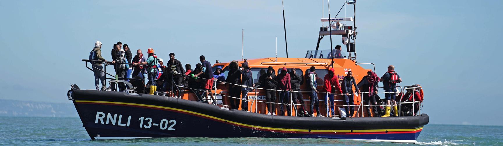 A group of people thought to be migrants are brought in to Dungeness, Kent, onboard an RNLI Dungeness Lifeboat, following a small boat incident.
