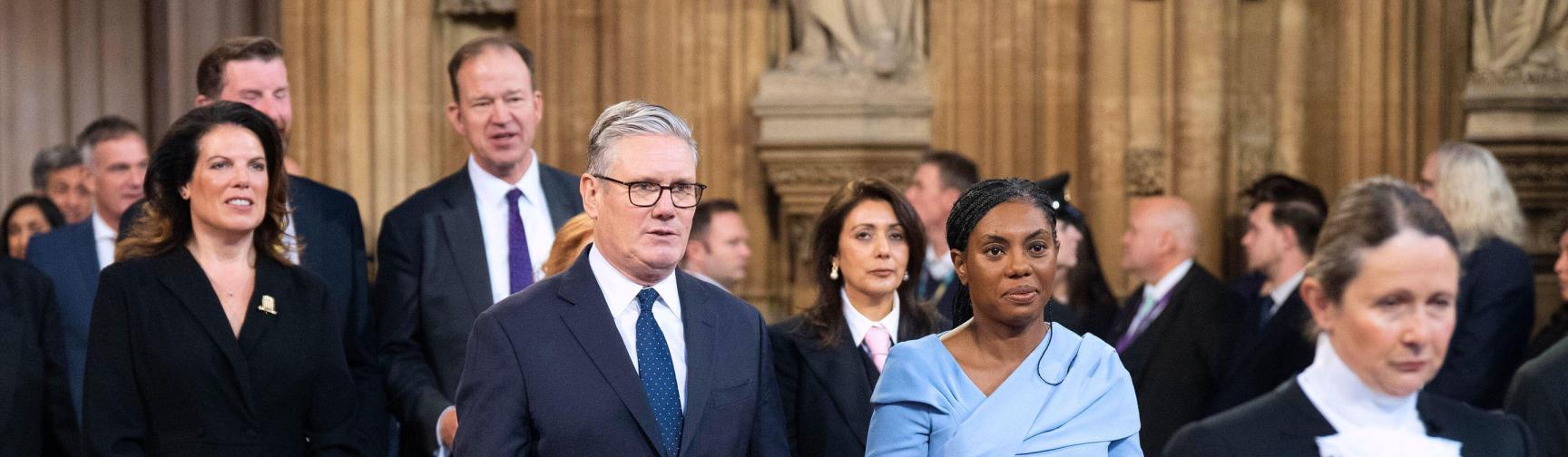 The Prime minister, Keir Starmer and leader of the Conservative Party, Kemi Badenoch walk through the Central Lobby of the Houses of Parliament in London to the House of Lords to hear the King's Speech during the State Opening of Parliament. 