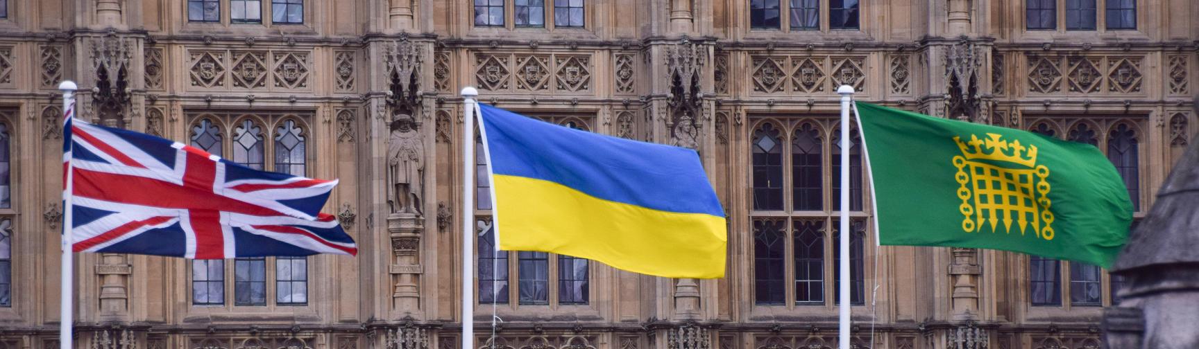Union Jack, Ukraine and the Parliament flag flying outside the Palace of Westminster.