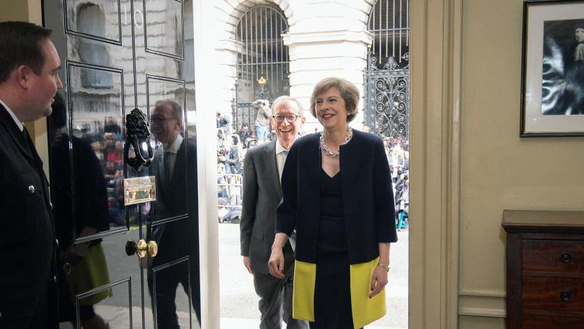 Theresa May, followed by her husband Philip May, walk into 10 Downing Street, London, Wednesday July 13, 2016. 