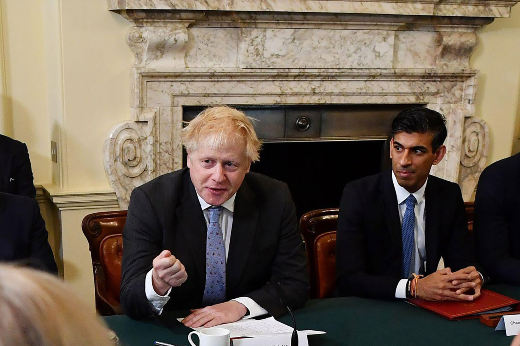 Boris Johnson and Rishi Sunak sitting together