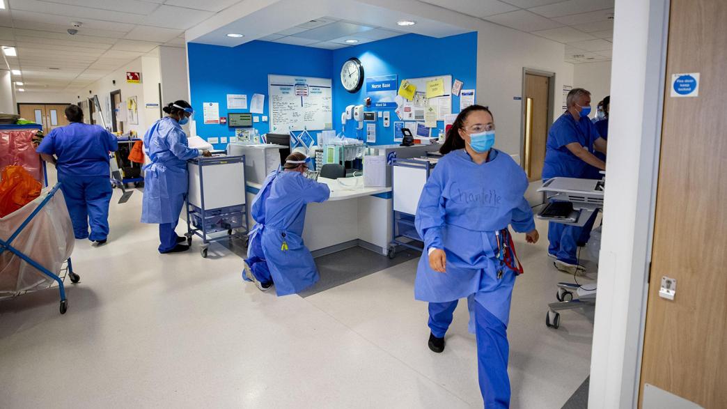 NHS staff in a busy ward.