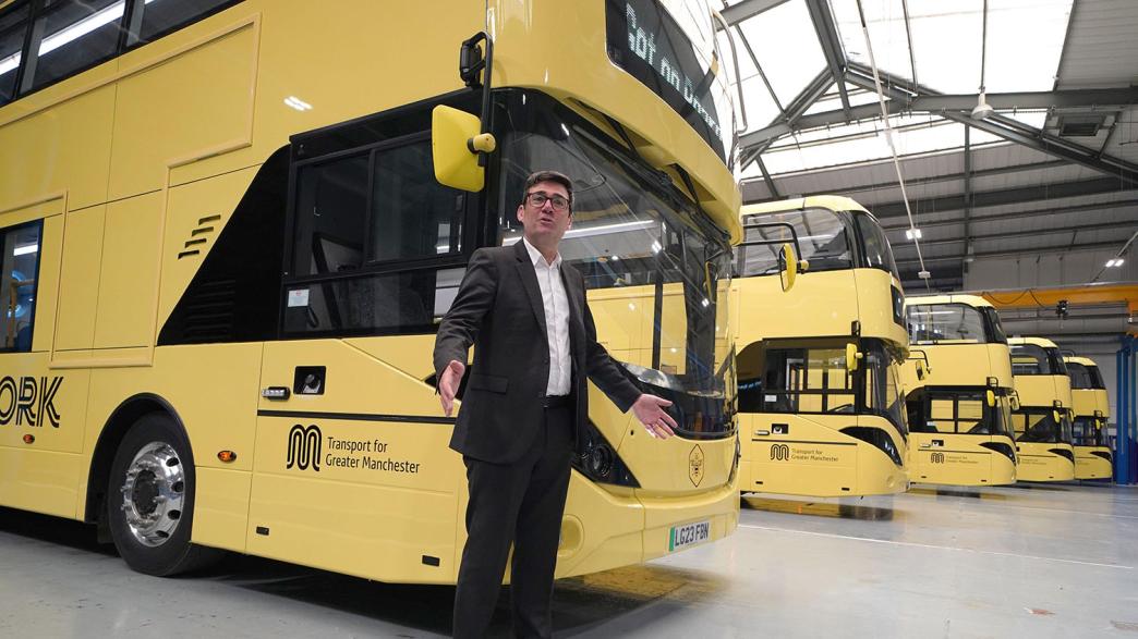 Greater Manchester mayor Andy Burnham views the 'Bee Network' buses 