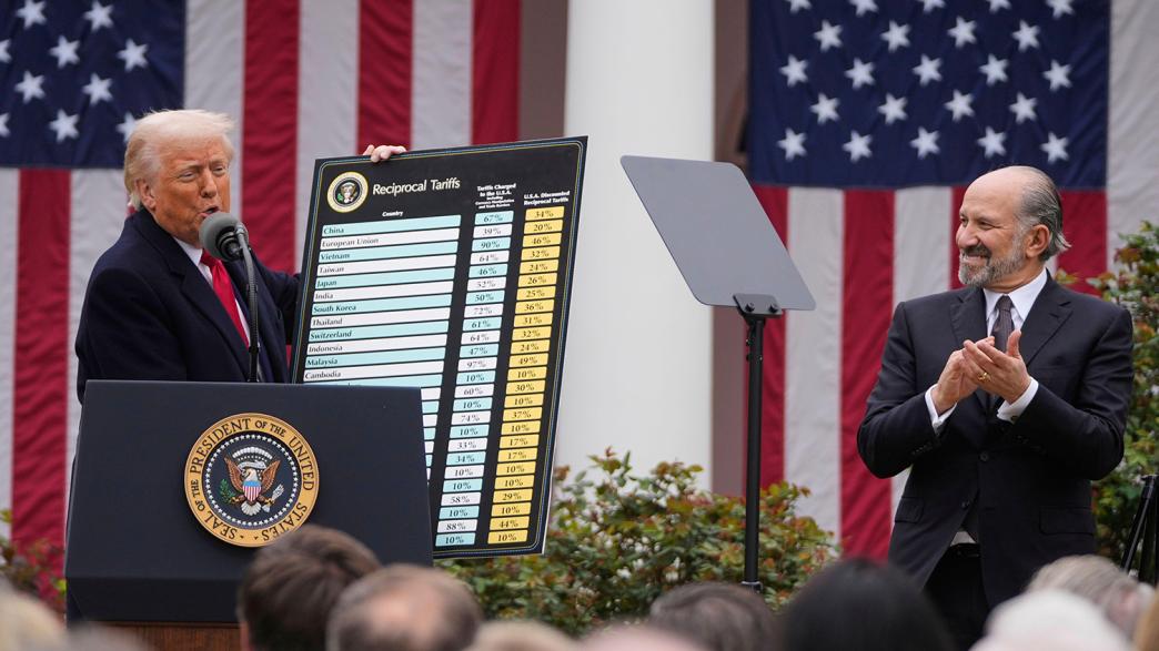 President Donald Trump speaks during an event to announce new tariffs in the Rose Garden at the White House, Wednesday, April 2, 2025, in Washington, as Commerce Secretary Howard Lutnick listens.